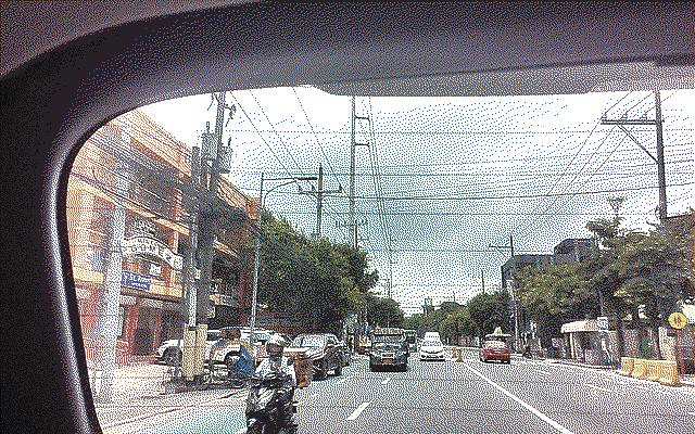 Street traffic with a jeepney approaching