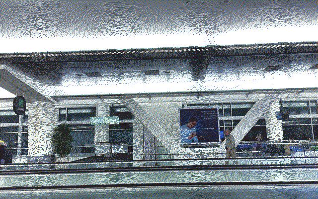 A photo of a moving walkway in SFO