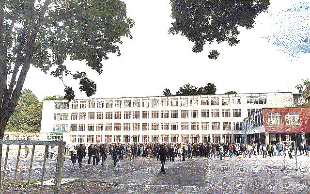 A school in Sofia with a big crowd of parents and students in front