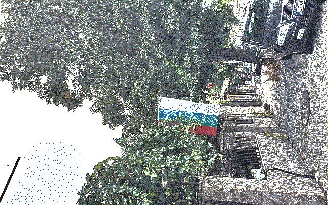 The Bulgarian flag handing from a house